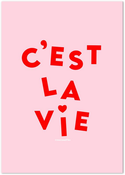 Pink poster with bold red text reading C'est La Vie and a small heart accent