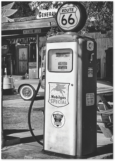 Black and white photo of a vintage Route 66 Mobilgas fuel pump outside a general store